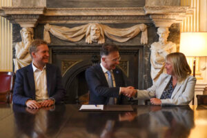 NSSLGlobal CEO shakes hand with FCDO CEO